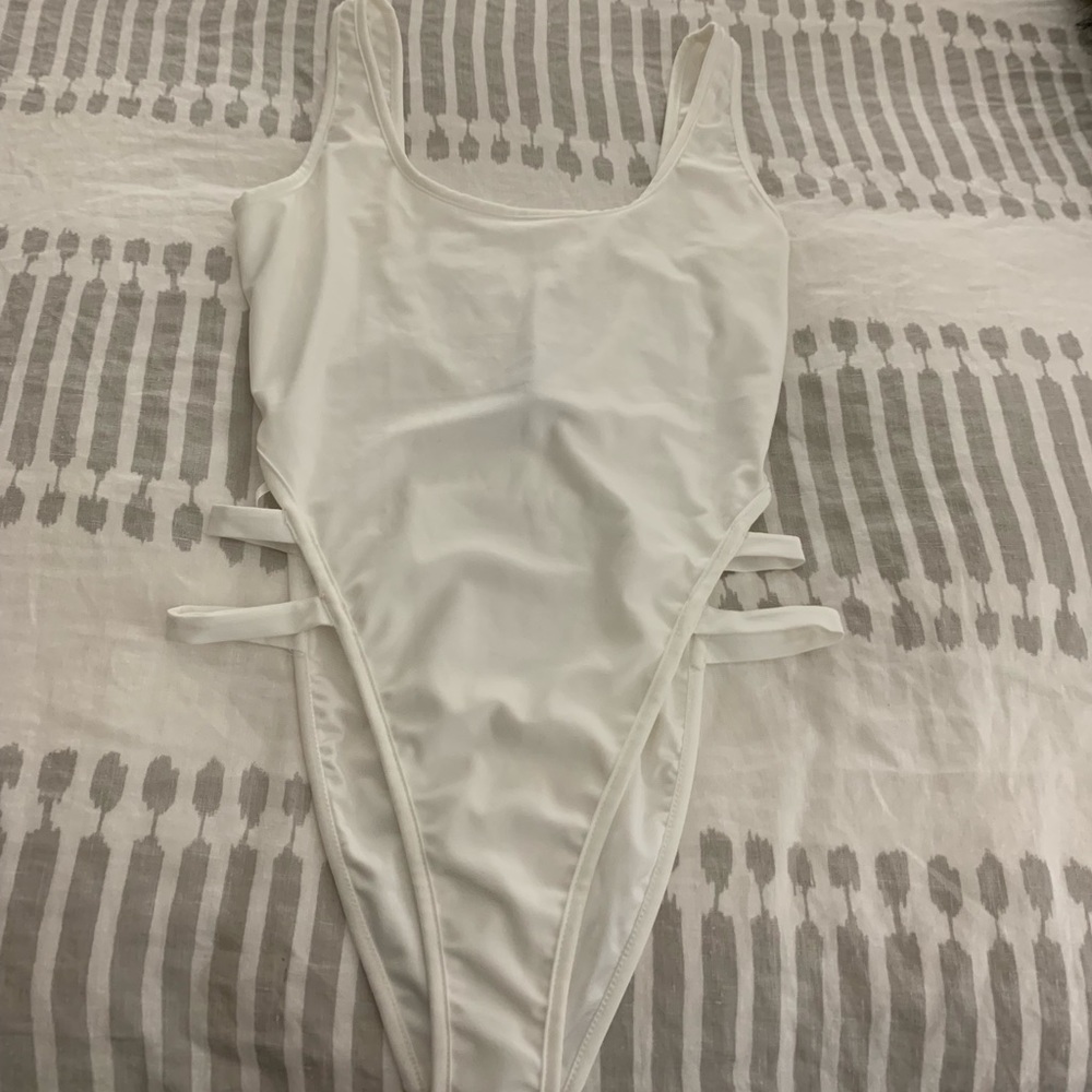 White high leg swim suit. Never worn. NWT